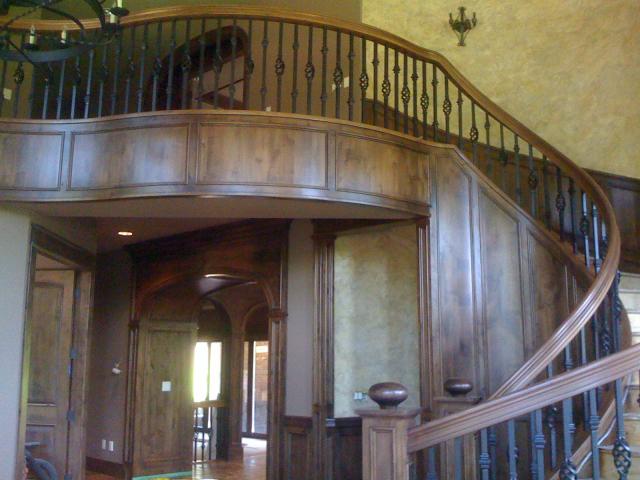 Custom Woodwork on a curved staircase with railing